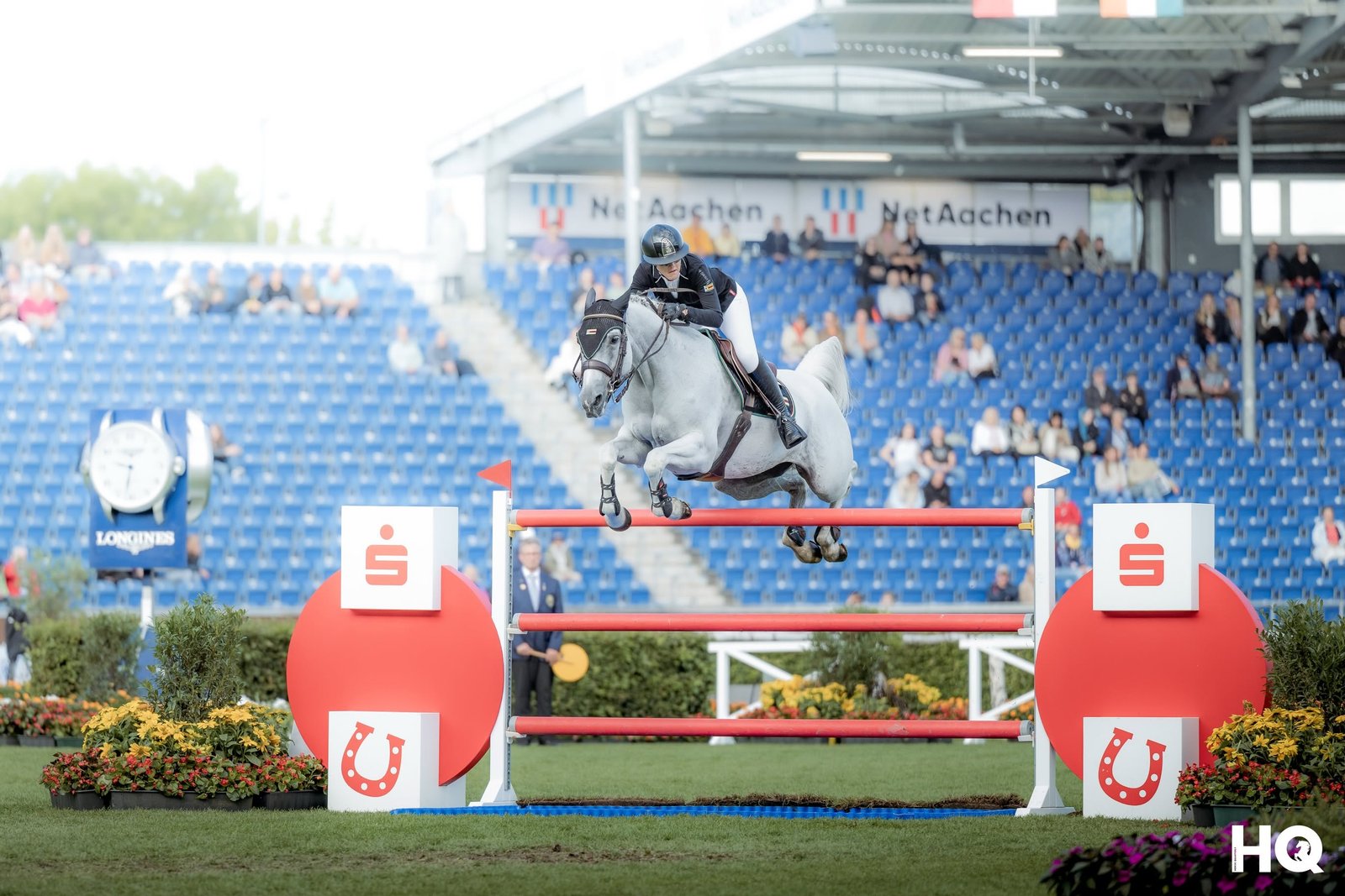 Horse and rider jumping at Aachen